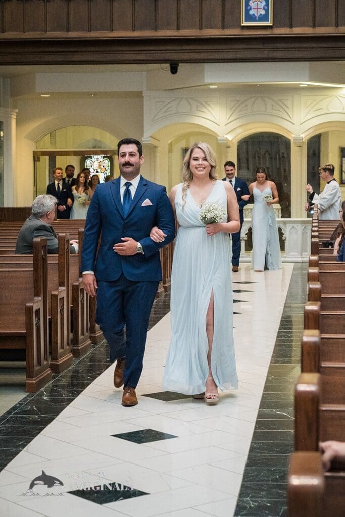 Groomsmen and bridesmaids walking down the aisle at the Cathedral Basilica of the Immaculate Conception Wedding