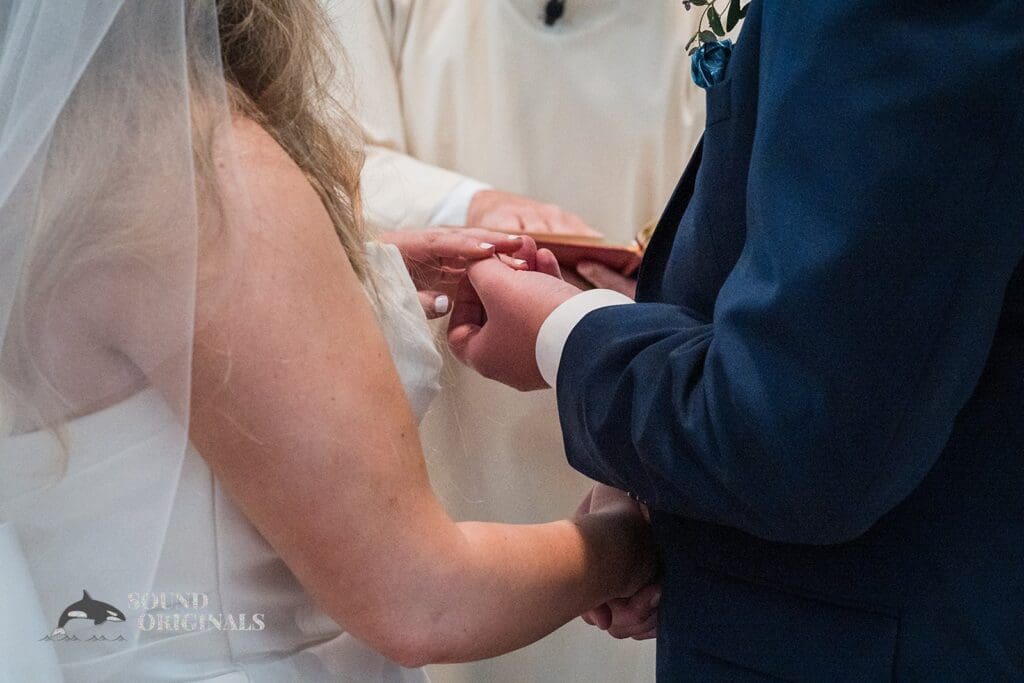 Bride and groom hold hands at the Cathedral Basilica of the Immaculate Conception Wedding