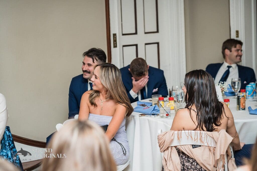 Guests enjoying speeches after Cathedral Basilica of the Immaculate Conception Wedding