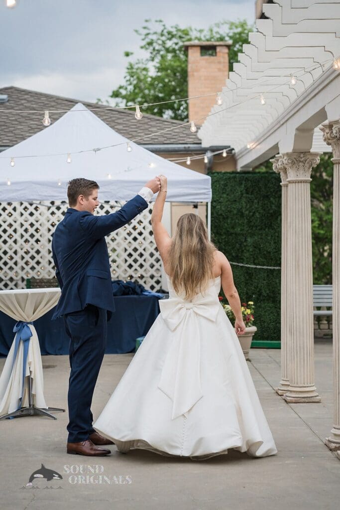 Happy couple dances outside after Cathedral Basilica of the Immaculate Conception Wedding