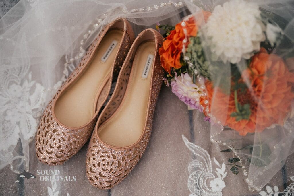 Kiara + Paul Beautiful pair of shoes and flowers at The Carey Gardens Wedding