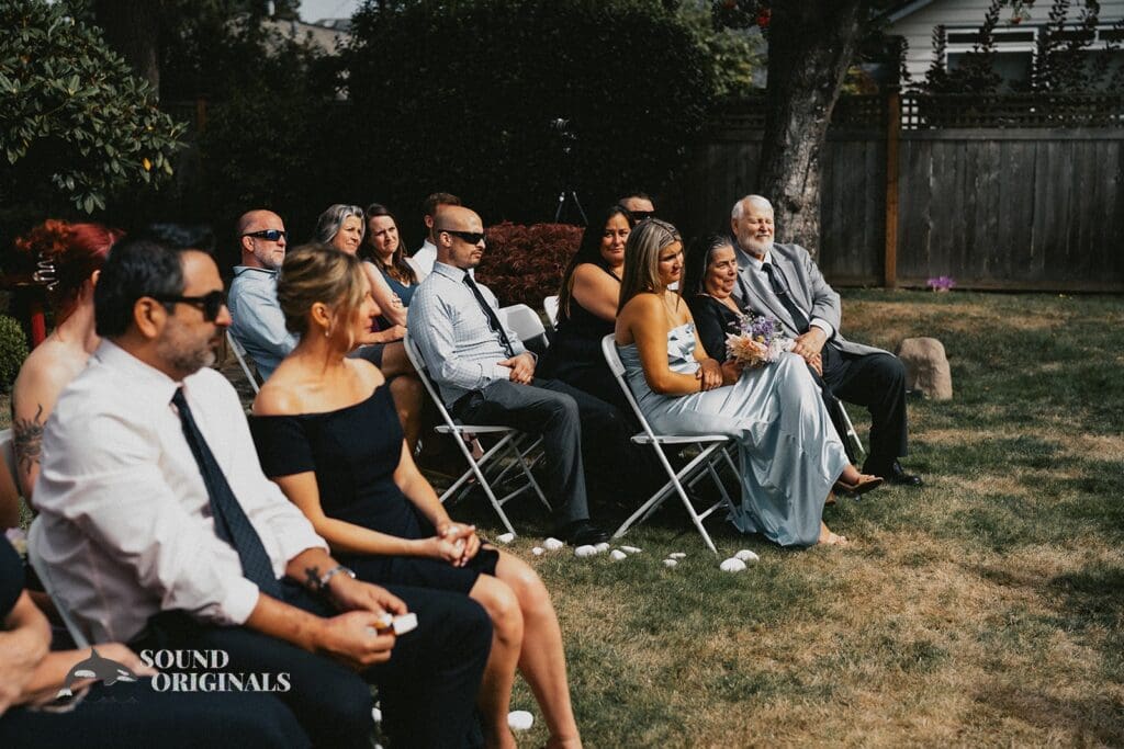 Kiara + Paul Wedding guests sit beautifully at The Carey Gardens