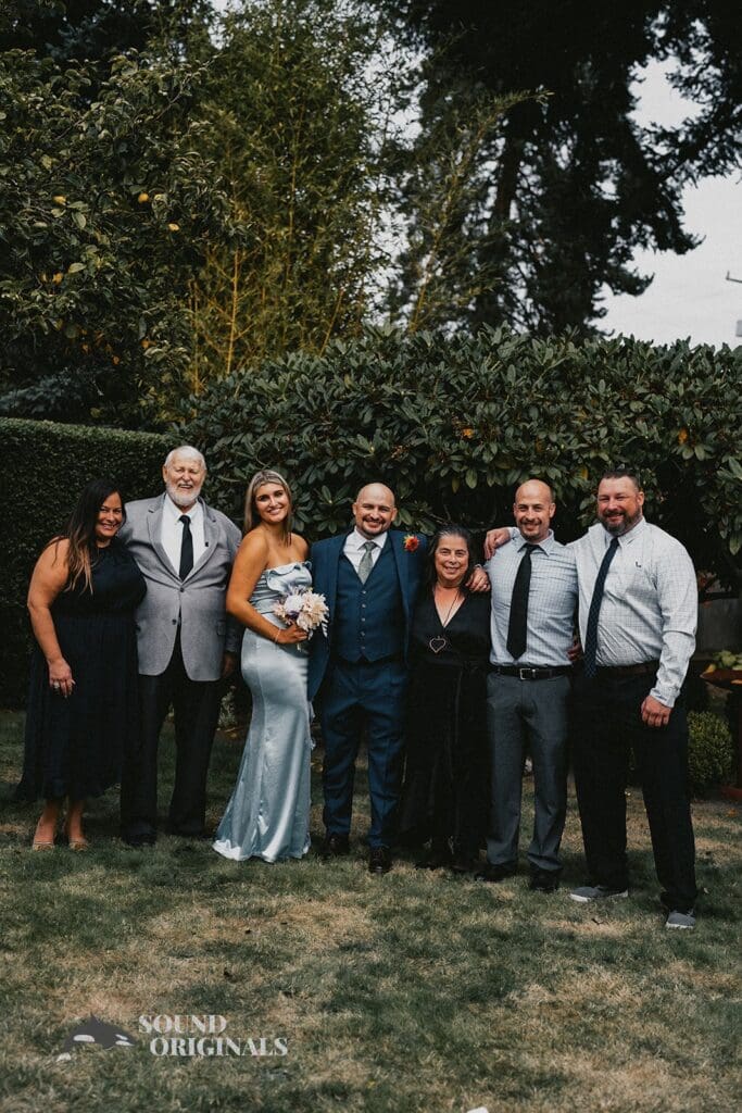 Kiara + Paul Groom takes pictures with family and friends