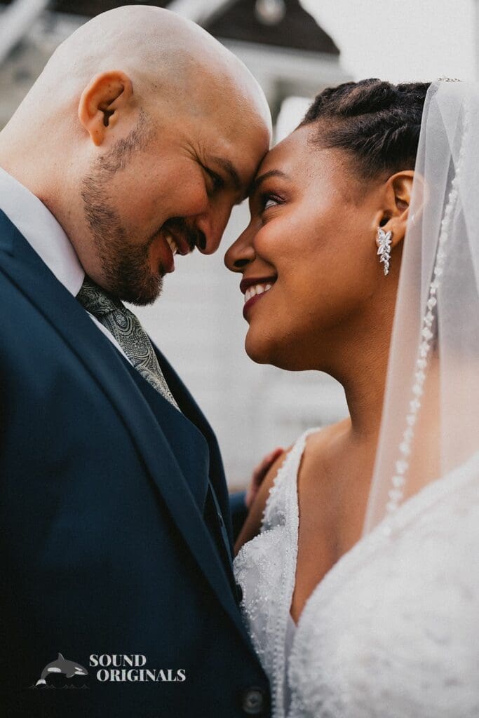 Kiara + Paul Husband and wife seal the day with beautiful smiles at The Carey Gardens