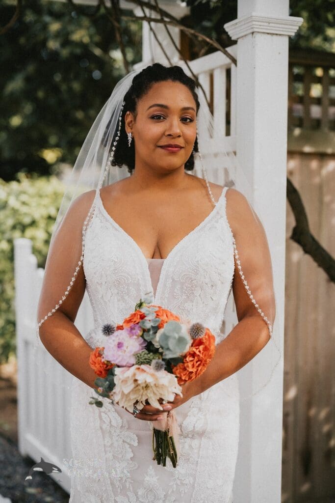 Kiara + Paul Beautiful bride of The Carey Gardens stands in awe