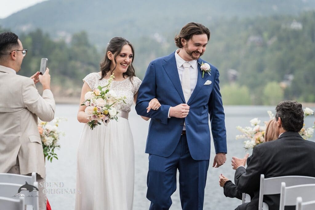 Bride and groom in Evergreen Lake House Wedding happy over a successful marital vows exchange