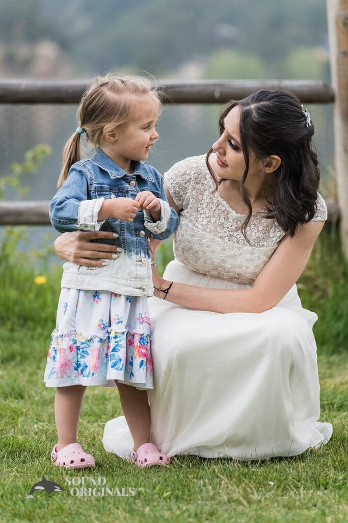 Pretty bride with little Flower girl in Evergreen Lake House Wedding