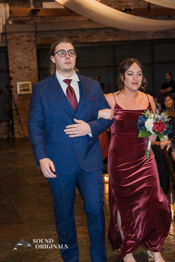 Groom man and maid of honour walk in beautifully at the Historic 1625 Tacoma Place Wedding