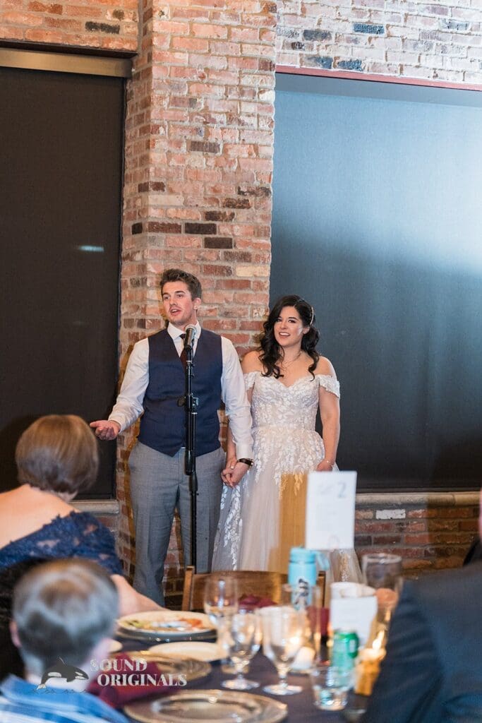 Elegant bride and groom addressing the guests in the Historic 1625 Tacoma Place Wedding reception