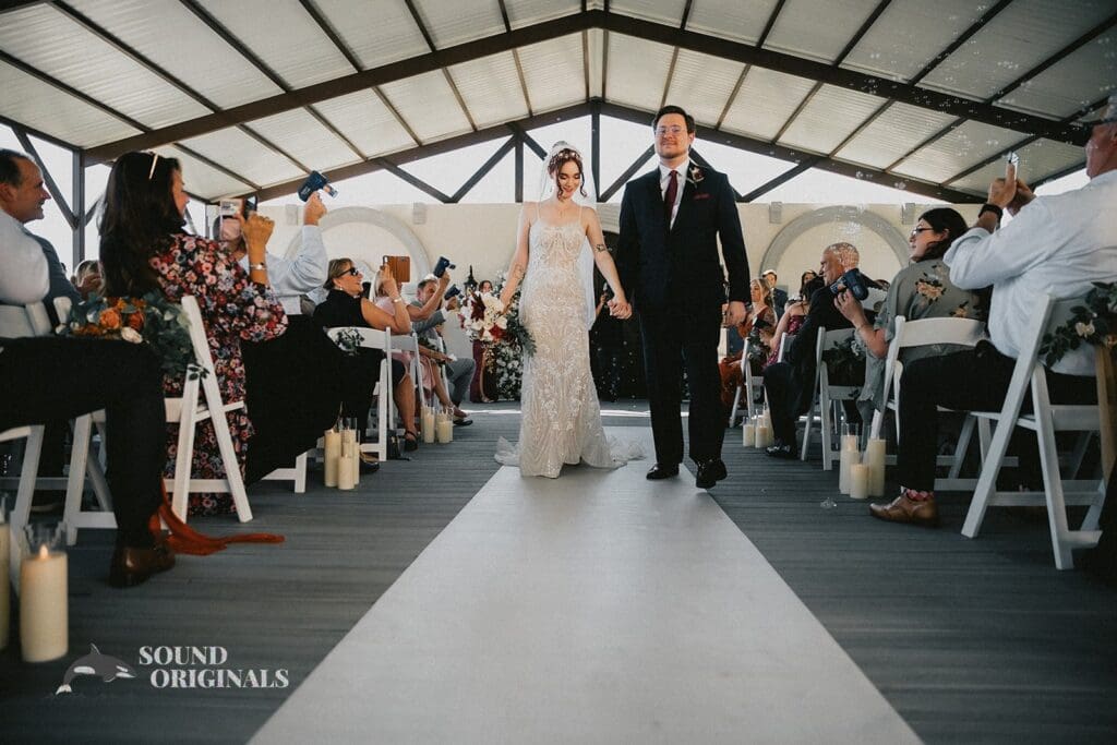 The happy couple leaving the ceremony at the Stoney Ridge Villa Wedding