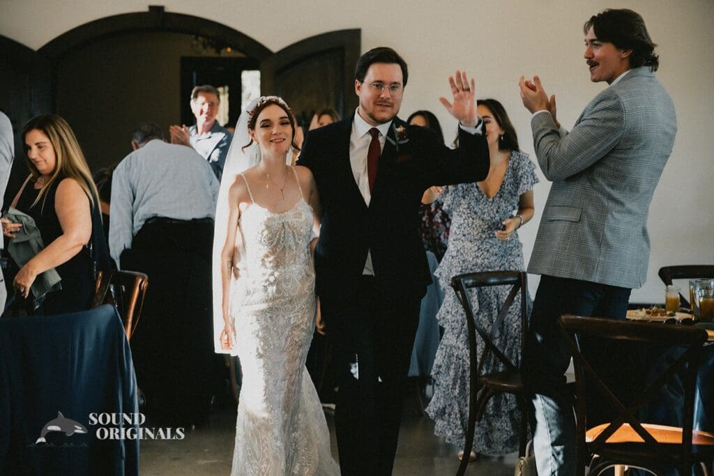 The entrance of the bride and groom at their Stoney Ridge Villa Wedding reception