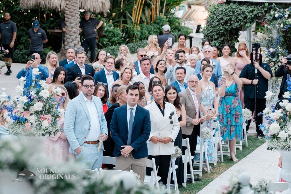 Guests upstanding for the arrival of the bride at The Palms Hotel & Spa Wedding