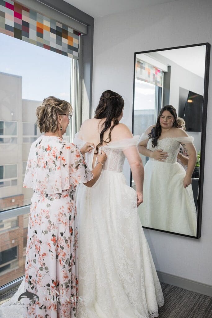 Bride fitting her wedding gown at Willow Heights
