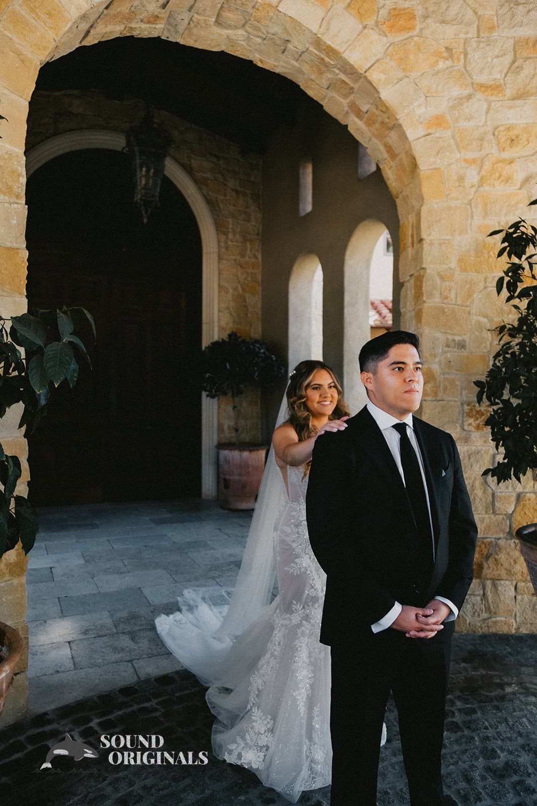 Beautiful bride and groom take a charming shot in front of The Havens Country Club