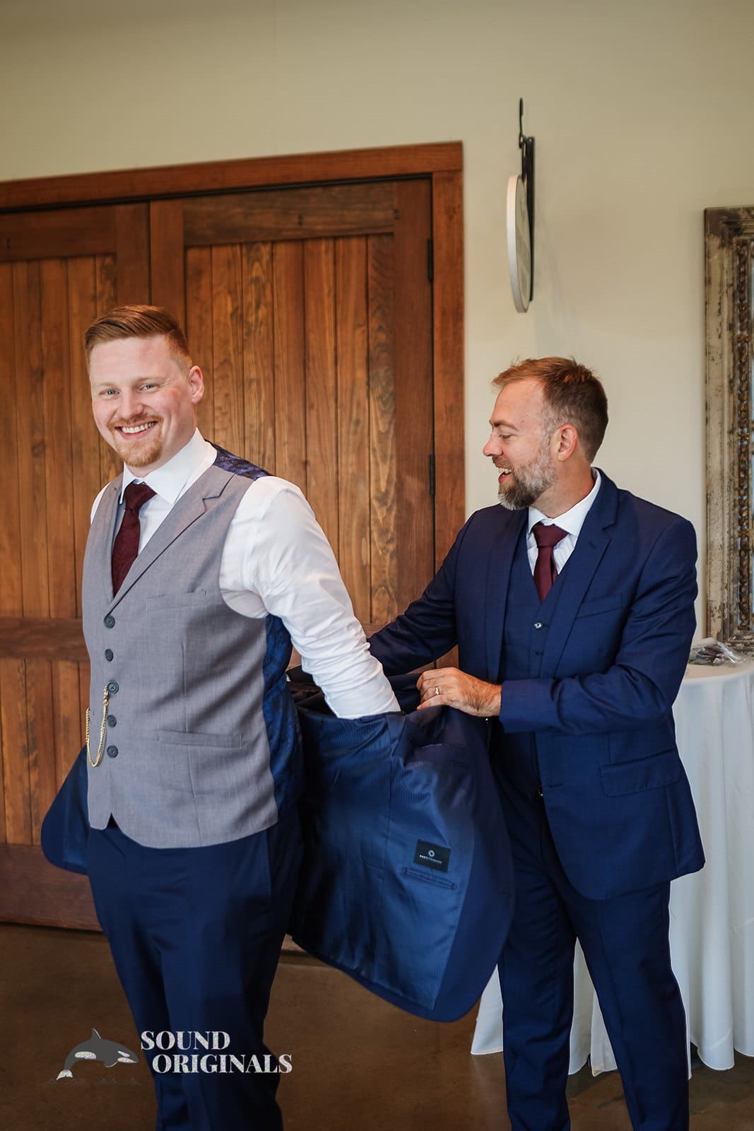 Groomsman helping groom get set for his big day at Folino Estate Winery