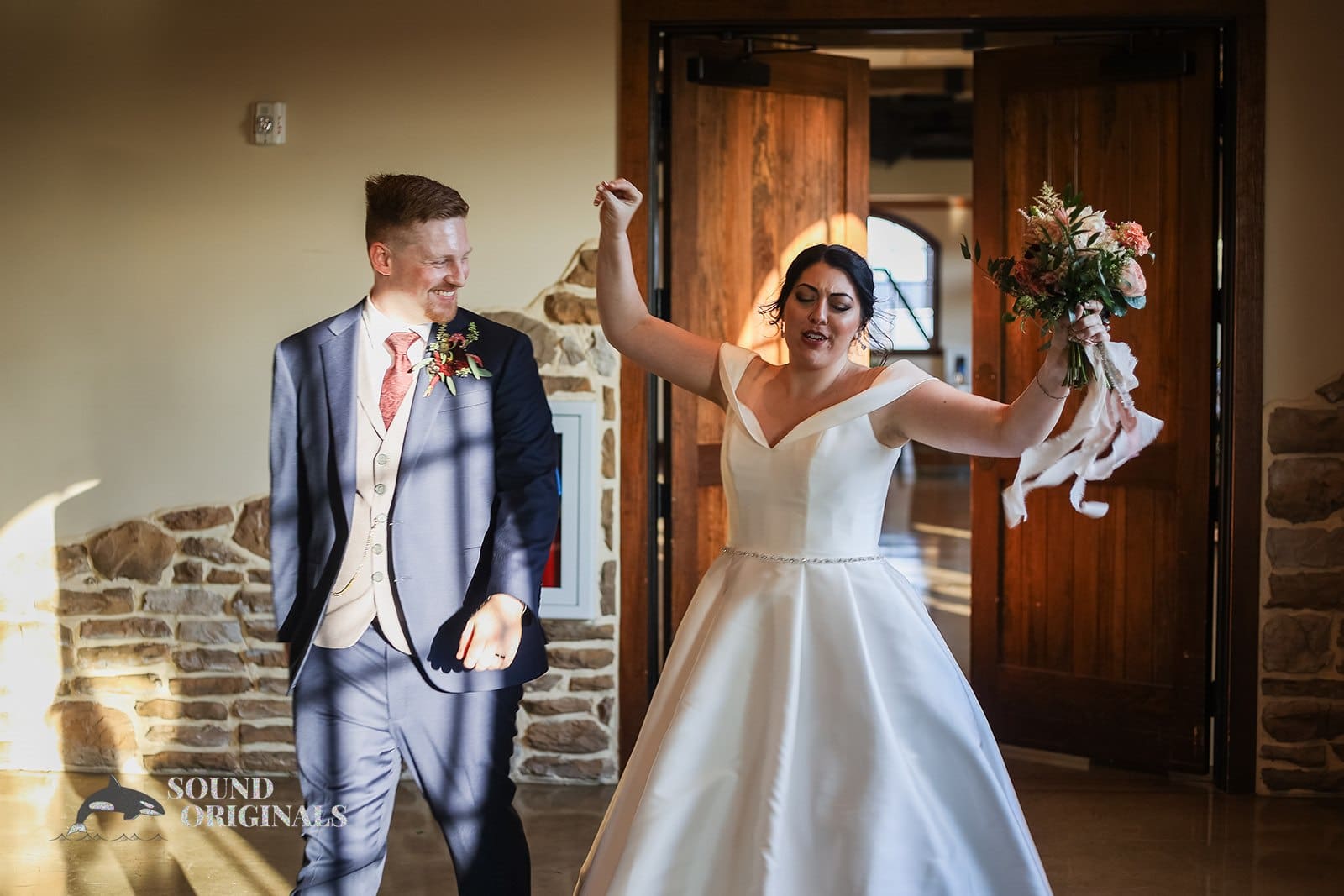 Groom grinning at his dancing bride at Folino Estate Winery
