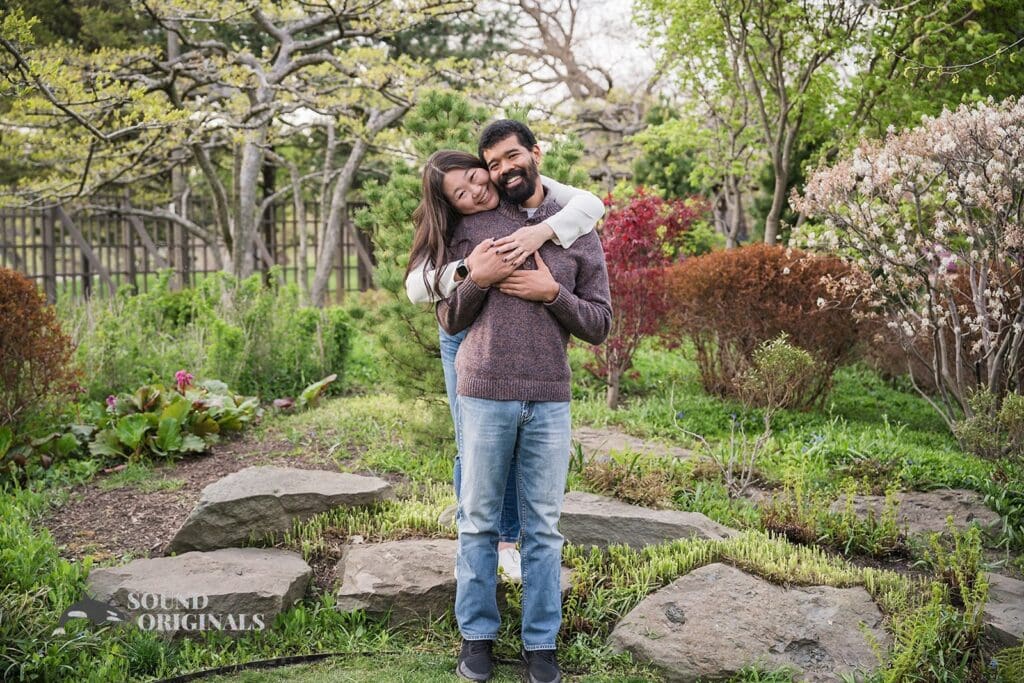couple having a sweet tight hug at Osaka Garden