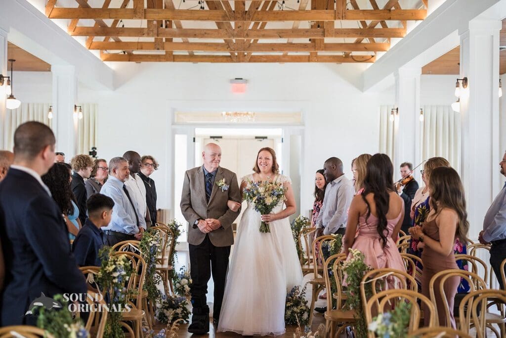 Dad and bride make a charming entrance in The Cliff House Dallas Wedding