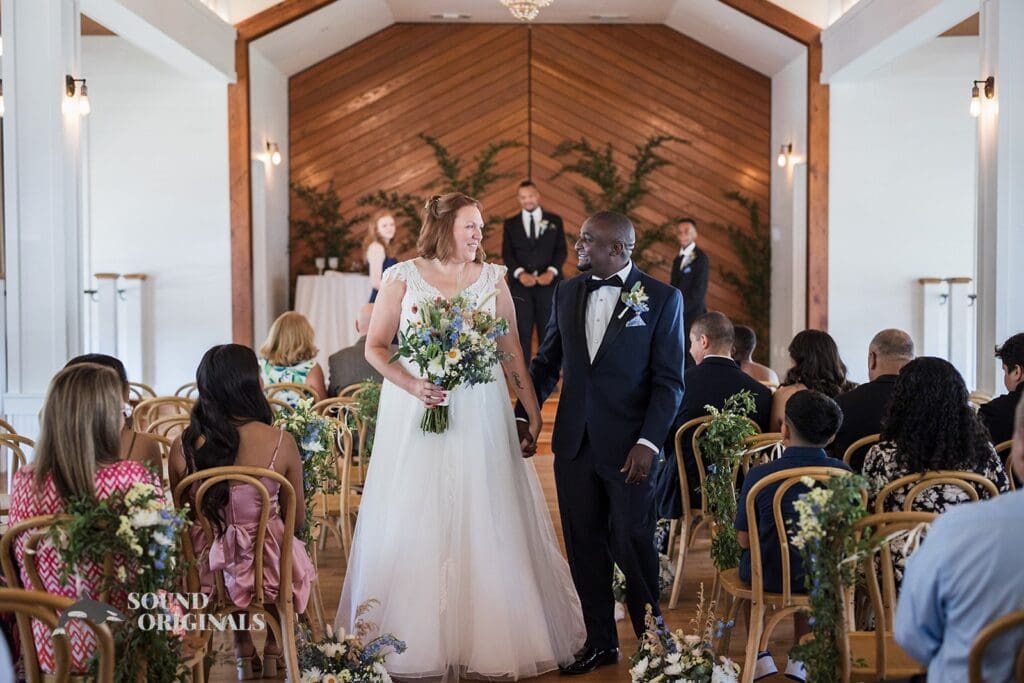 The Cliff House Dallas Wedding bride and groom are happy over a successful exchange of marital vows exchange