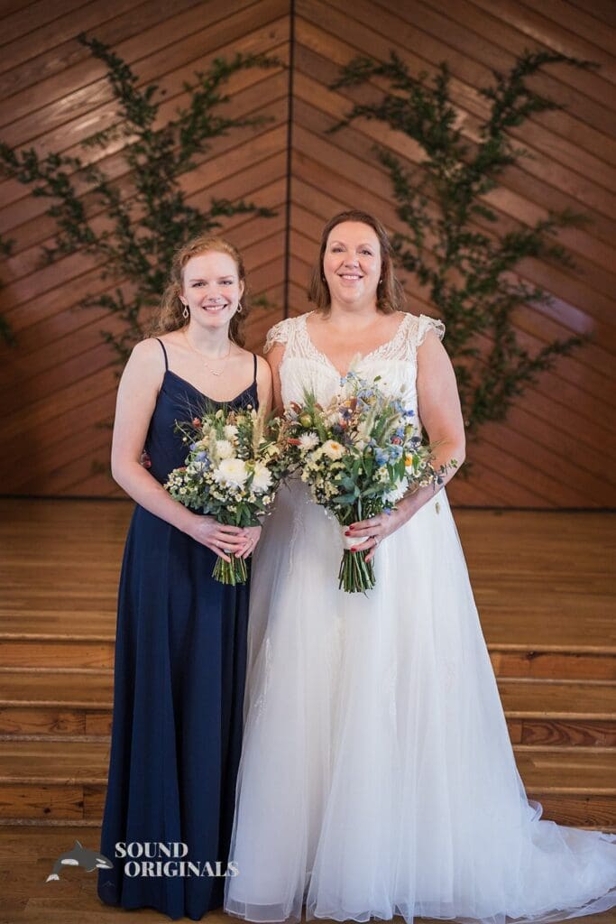 Bride and maid of honour in front of The Cliff House Dallas Wedding altar