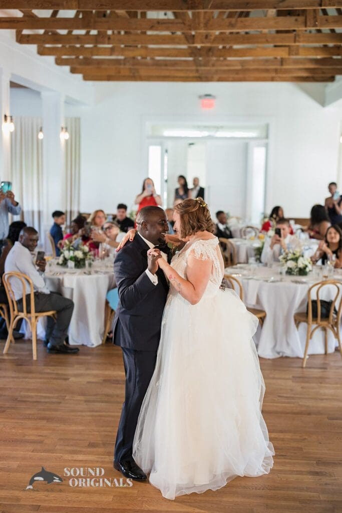 Husband and wife give off gentle dance steps in The Cliff House Dallas Wedding