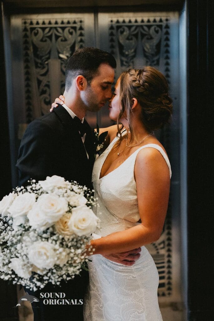 A Kiss Between the Newlyweds at The Carlisle Room Wedding
