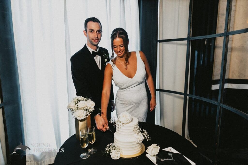 The Bride and Groom Cut the Cake at The Carlisle Room Wedding