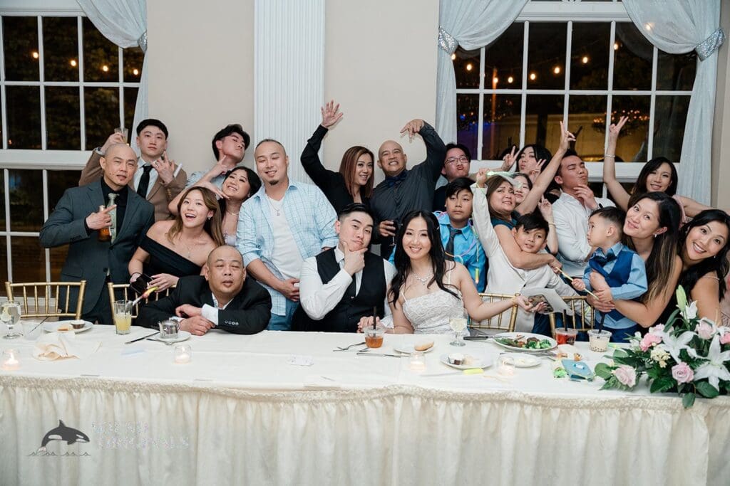 Bride and groom with their guests at The Abbington Distinctive Banquets Wedding