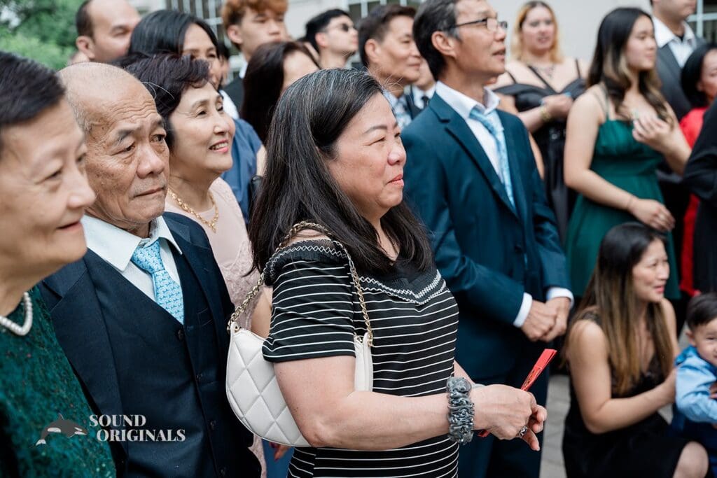 Family and friends watching as the couple make their vows at The Abbington Distinctive Banquets Wedding