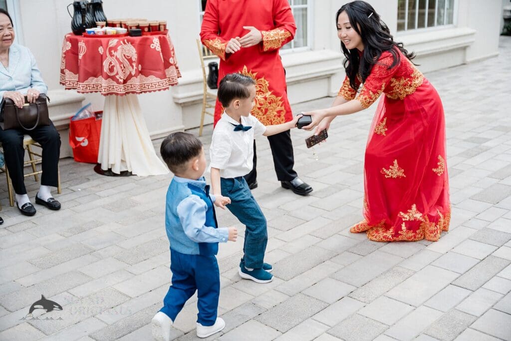 The ring bearers handing over the rings at The Abbington Distinctive Banquets Wedding