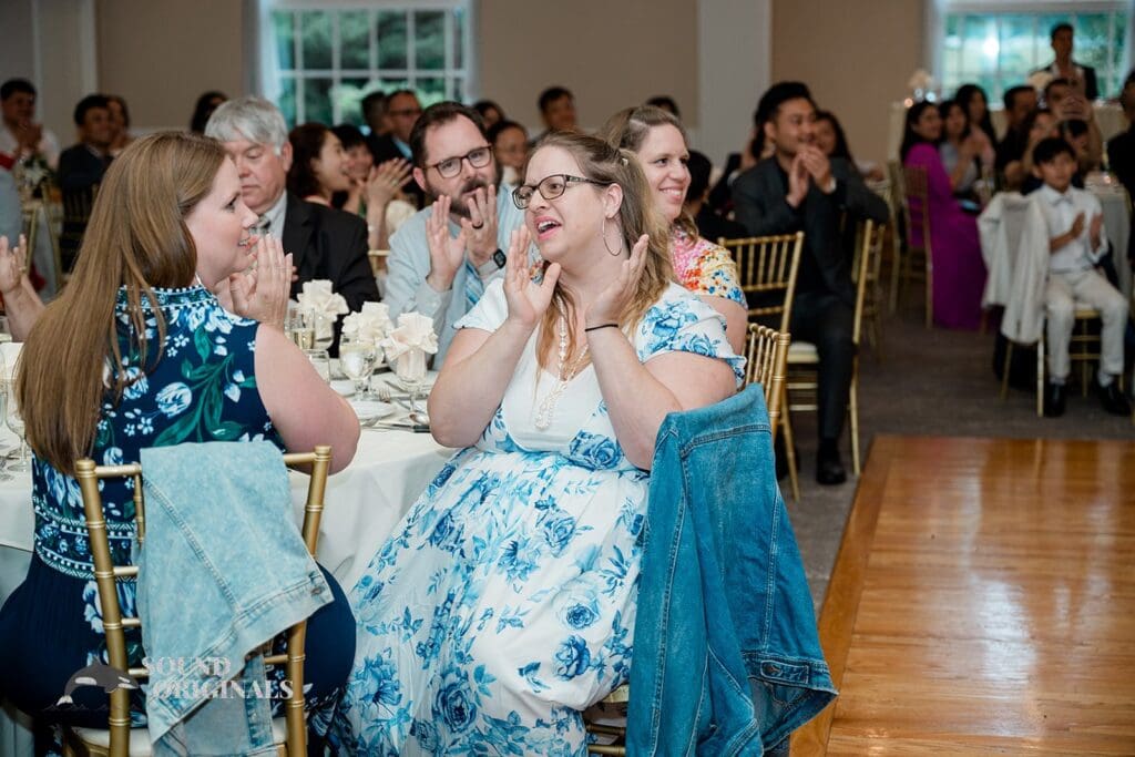 Guests clapping at the The Abbington Distinctive Banquets Wedding reception