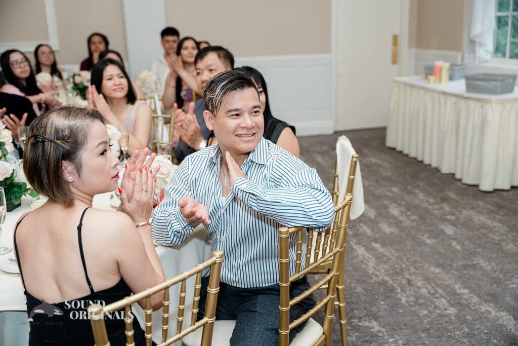 Guests applauding at The Abbington Distinctive Banquets Wedding reception