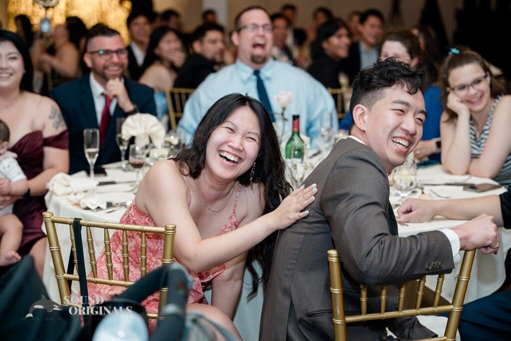 Guests laughing at The Abbington Distinctive Banquets Wedding
