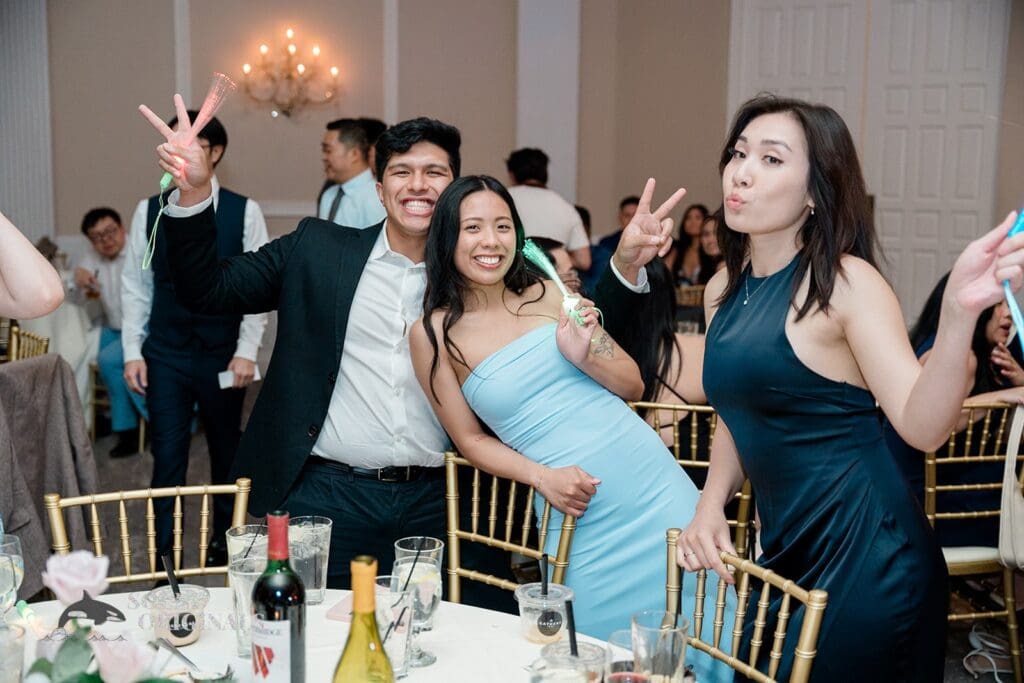 Guests posing for photos at The Abbington Distinctive Banquets Wedding