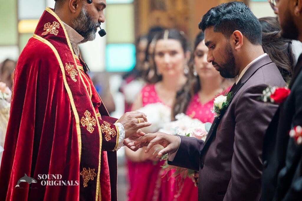 The groom receiving his ring at the Embassy Suites by Hilton Naperville Wedding