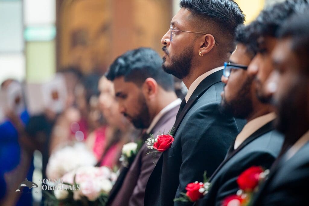 The groomsmen with rose buttonholes at the Embassy Suites by Hilton Naperville Wedding