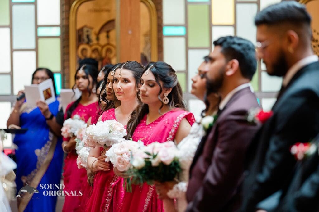 The bridal party standing at the altar of the Embassy Suites by Hilton Naperville Wedding