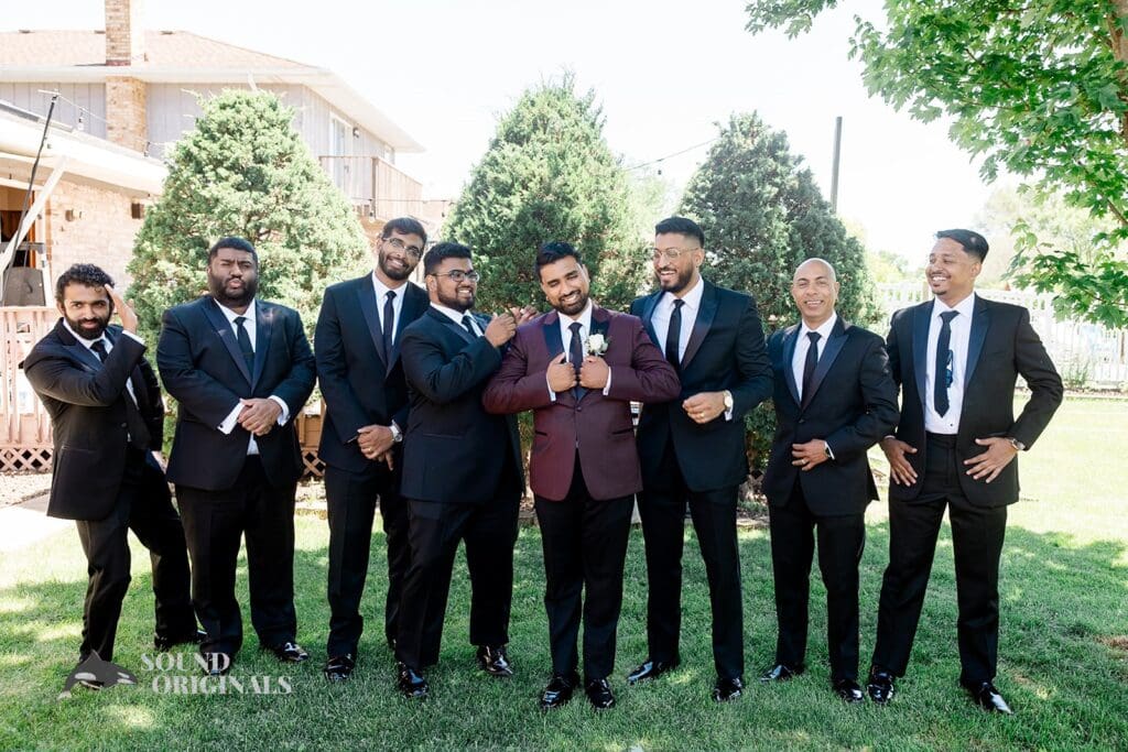 The groom and his groomsmen posing before the Embassy Suites by Hilton Naperville Wedding