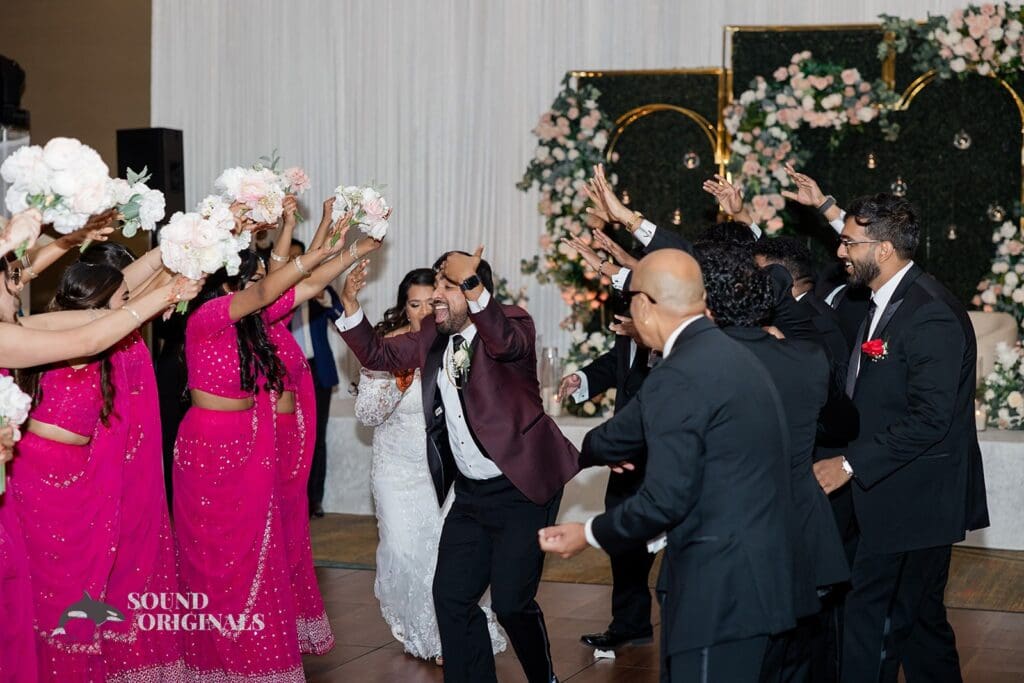 The bride and groom dancing with their bridal party at the Embassy Suites by Hilton Naperville Wedding