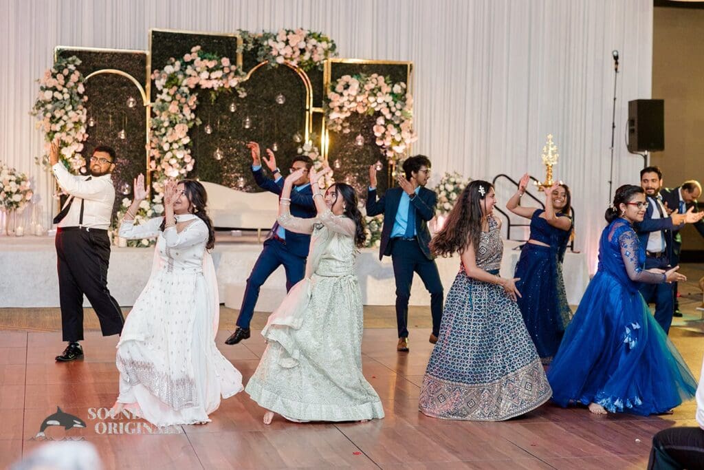 Wedding guests performing a dance at the Embassy Suites by Hilton Naperville Wedding