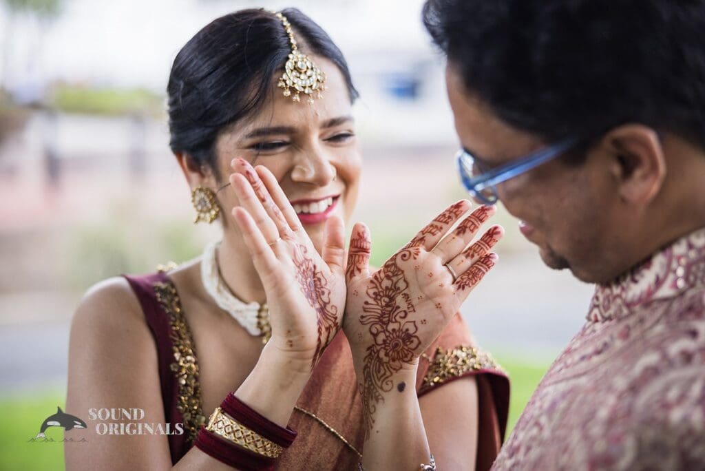 The bride showing the groom her henna at Torpedo Factory Art Center Wedding