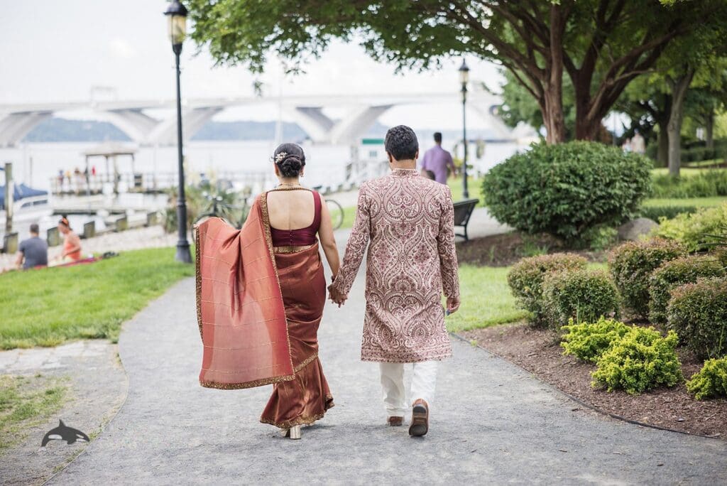 Bride and groom walking away hand in hand near Torpedo Factory Art Center