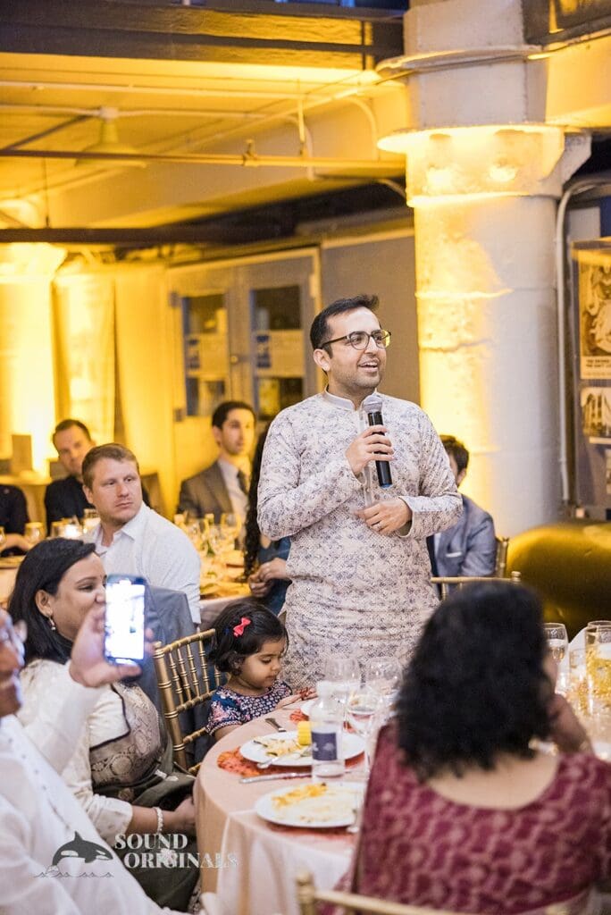 Wedding guest sharing speech at Torpedo Factory Art Center Wedding