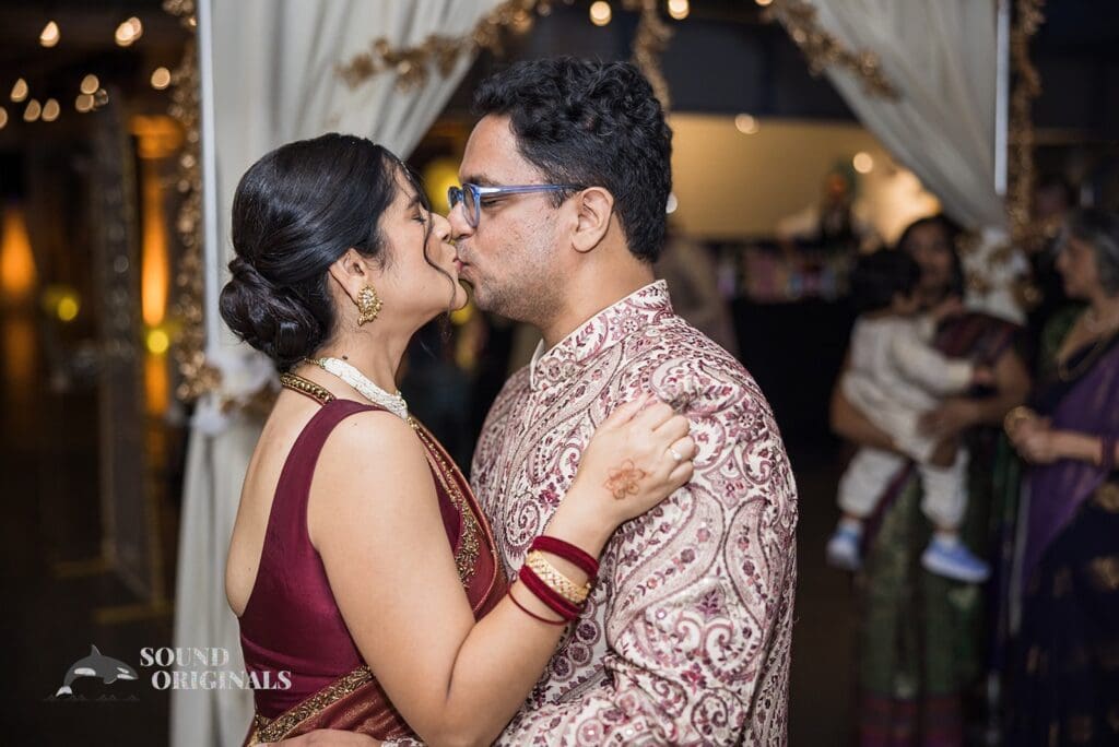 Kiss between bride and groom at Torpedo Factory Art Center Wedding