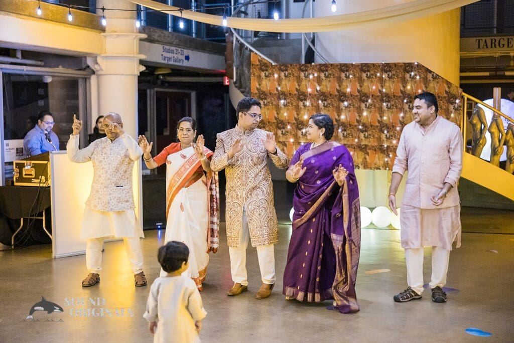 The groom doing a chorreographed dance with guests at the Torpedo Factory Art Center Wedding