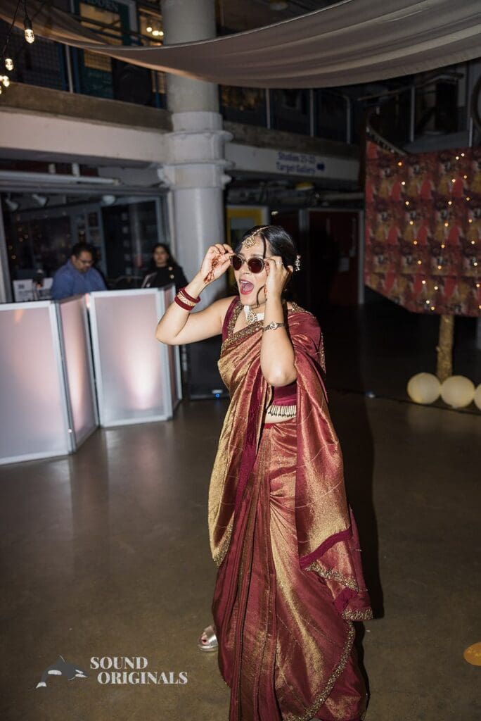 The bride posing with sunglasses at the Torpedo Factory Art Center Wedding