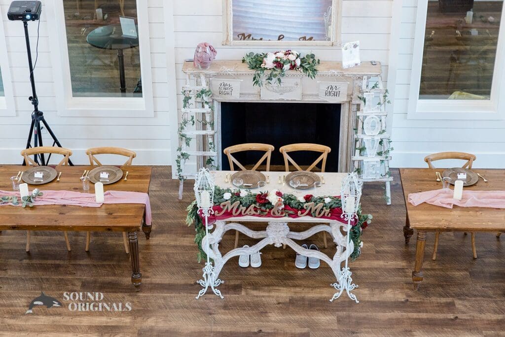 Photographer captures classy couple seat at The French Farmhouse Wedding reception