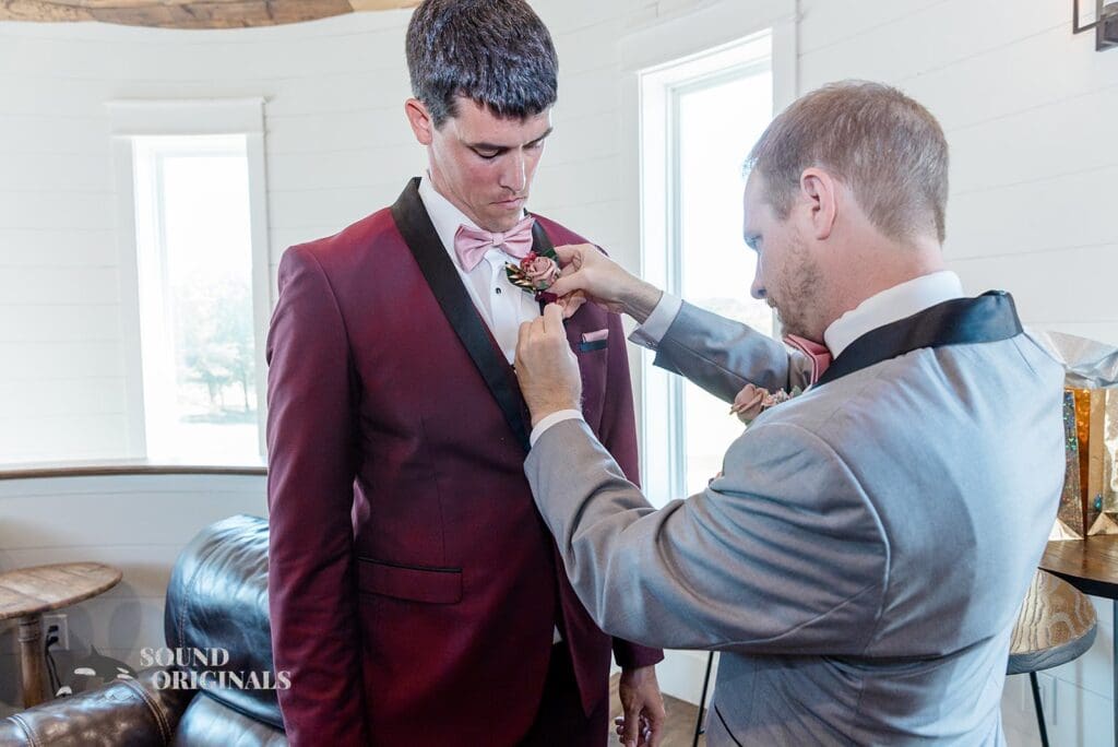 Groom's man gets groom ready for The French Farmhouse Wedding
