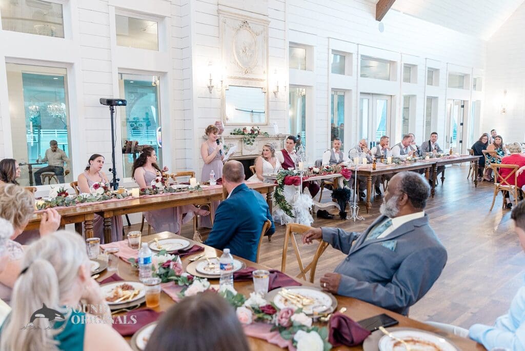 Guests in awe as the bride's maid of honour reads out her goodwill message to the couple in The French Farmhouse Wedding