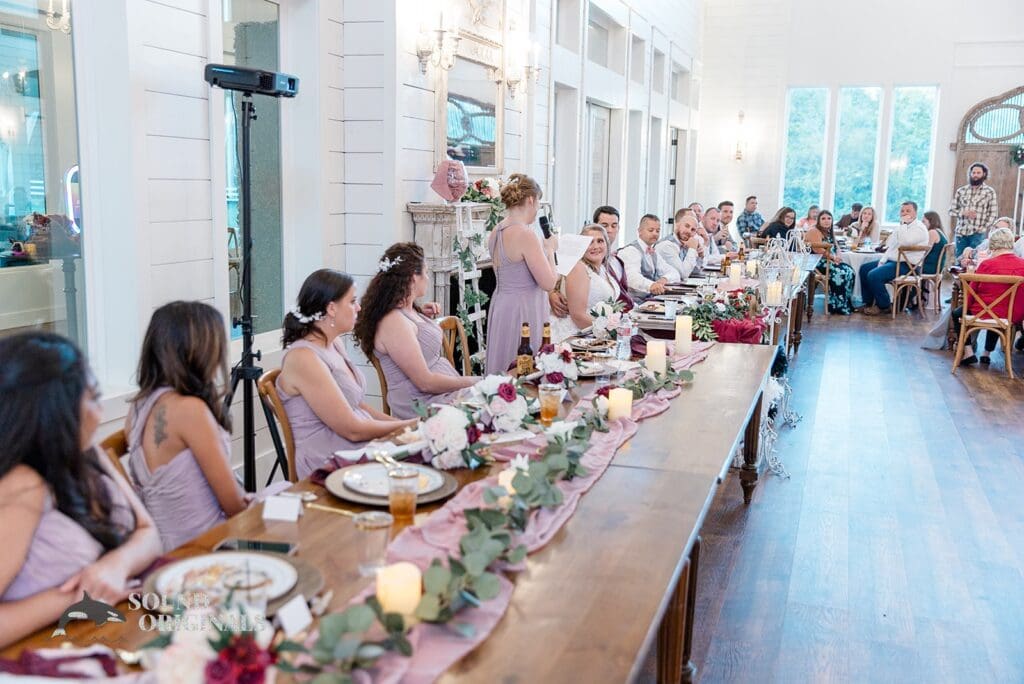 Photographer captures gorgeous bridesmaids in their colourful outfits in The French Farmhouse Wedding reception
